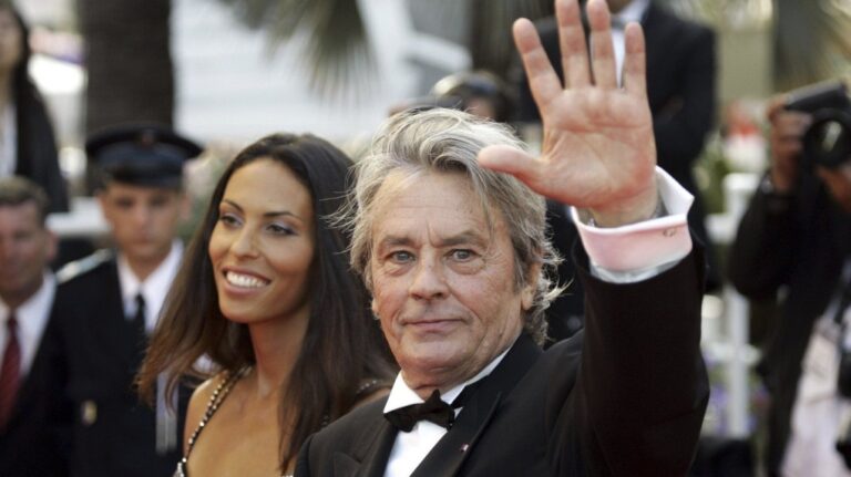 French actor Alain Delon and model Bianca di Sofia arrive for the screening of the film 'Chacun Son Cinema' ('To Each His Own Cinema'), at the 60th International film festival in Cannes, southern France, on Sunday, May 20, 2007.  (AP Photo/Andrew Medichini)