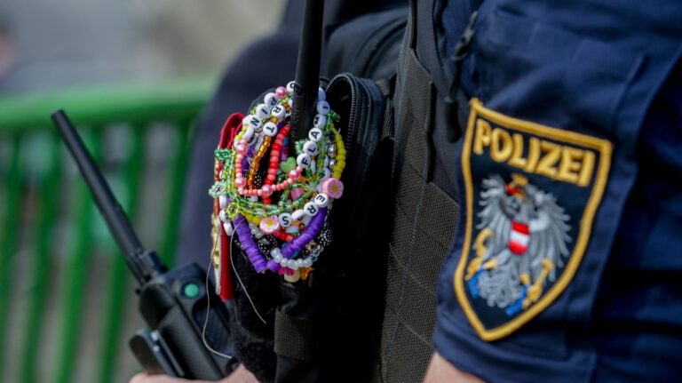 An Austrian police officer is decorated with bracelets in the city centre in Vienna on Thursday, Aug.8, 2024. Organizers of three Taylor Swift concerts in the stadium in Vienna this week called them off on Wednesday after officials announced arrests over an apparent plot to launch an attack on an event in the Vienna area such as the concerts. (AP Photo/Heinz-Peter Bader)