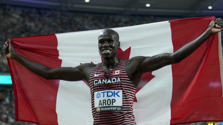 Marco Arop, of Canada celebrates winning the gold medal in the Men's 800-meters final during the World Athletics Championships in Budapest, Hungary, Saturday, Aug. 26, 2023. (AP Photo/Ashley Landis)