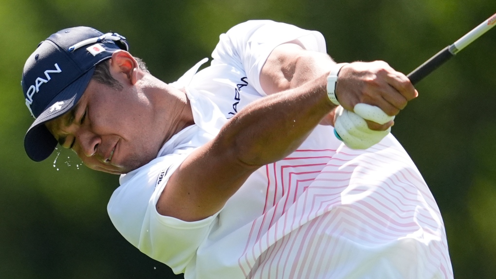 Hideki Matsuyama, of Japan, play his tee shot on the 14th hole during the first round of the men's golf event at the 2024 Summer Olympics, Thursday, Aug. 1, 2024, at Le Golf National in Saint-Quentin-en-Yvelines, France. (George Walker IV / AP Photo)