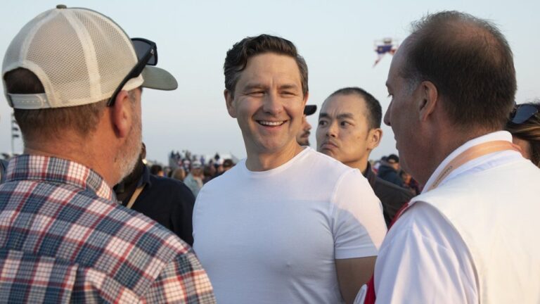 Conservative Party Leader Pierre Poilievre talks with people in the crowd prior to the National Acadian Day concert at the airport in Yarmouth, N.S., on Aug. 15, 2024. (Ron Ward/The Canadian Press)