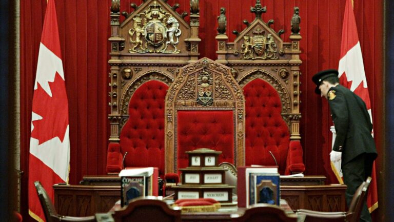 Senate security prepare the Senate chamber for its session on Parliament Hill in Ottawa Wednesday July 6, 2005. (Tom Hanson/The Canadian Press)