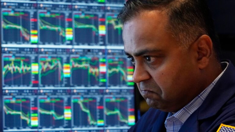 A specialist works at his post on the floor of the New York Stock Exchange, Monday, Aug. 5, 2024. (AP Photo/Richard Drew)
