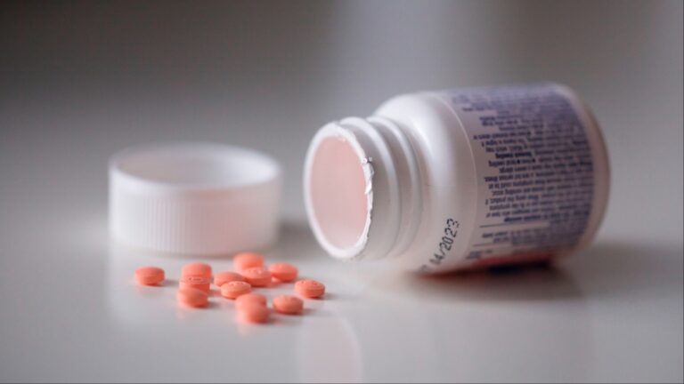 This Friday, Oct. 15, 2021 photo shows a bottle of aspirin in the Brooklyn borough of New York. (AP Photo/Emma H. Tobin)