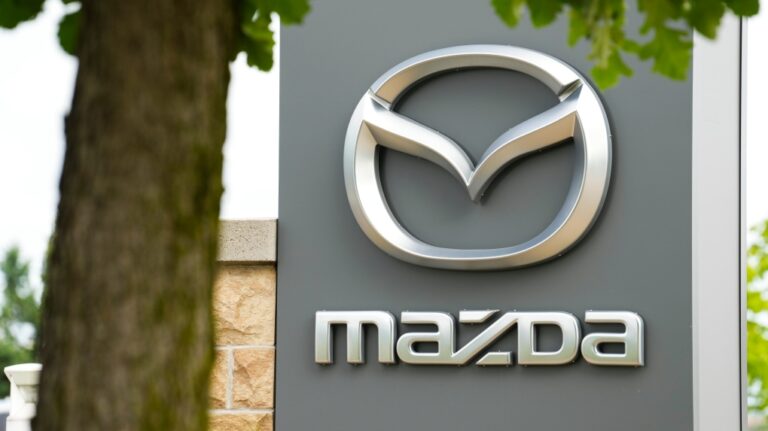 A Mazda vehicle logo is pictured on a car at an automotive dealership in Ottawa on Friday, Aug. 11, 2023. (Sean Kilpatrick / The Canadian Press)