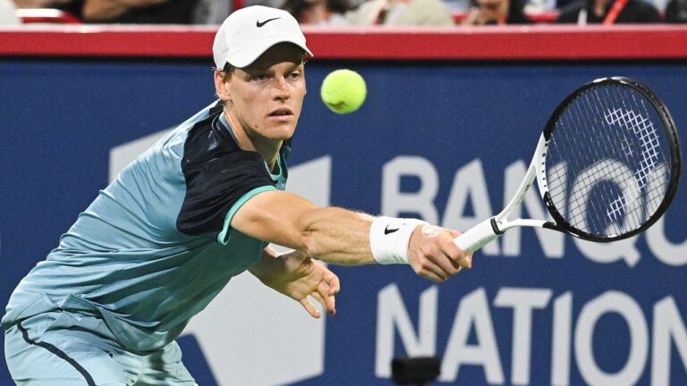 Jannik Sinner of Italy plays a shot to Andrey Rublev of Russia during their quarter-final match against at the National Bank Open tennis tournament in Montreal, Saturday, August 10, 2024. THE CANADIAN PRESS/Graham Hughes