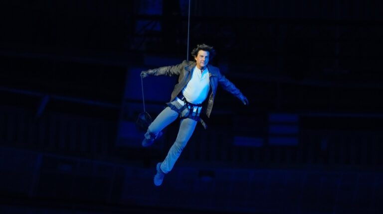 Tom Cruise is lowered on the State de France during the 2024 Summer Olympics closing ceremony on Aug. 11, 2024 in Saint-Denis, France. The 2028 Olympics will be in Los Angeles. (Natacha Pisarenko/AP via CNN Newsource)