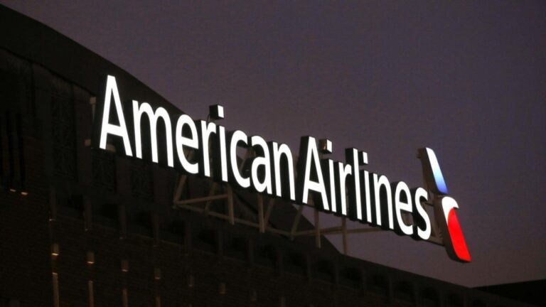 The American Airlines logo is shown on top of the American Airlines Center in Dallas, Texas on Dec. 19, 2017. (AP Photo/ Michael Ainsworth)