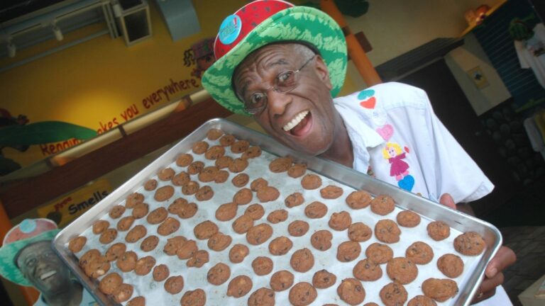 Wally Amos, pictured with a sheet of cookies at his home office in Kailua, Hawaii, in 2007, died at 88 years old. (Lucy Pemoni / AP via CNN Newsource)