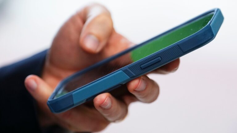 A person uses a cell phone in Ottawa on Monday, July 18, 2022. (Sean Kilpatrick/The Canadian Press)