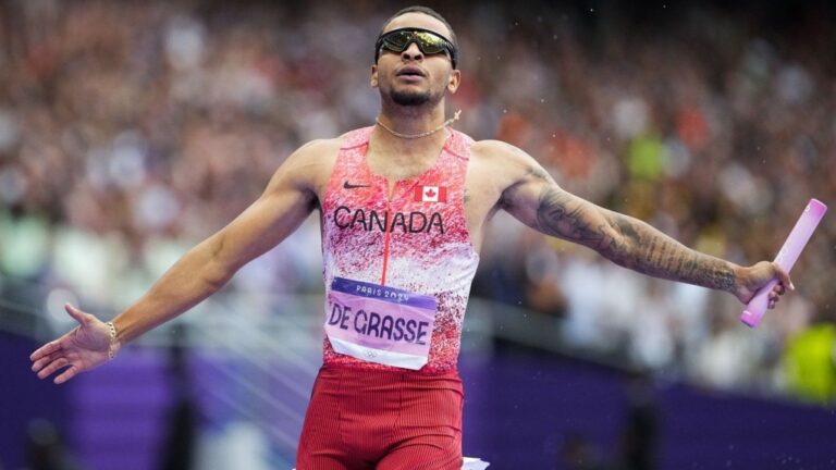 Andre de Grasse, of Canada, celebrates after winning the men's 4 x 100-meter relay final at the 2024 Summer Olympics, Friday, Aug. 9, 2024, in Saint-Denis, France. (Petr David Josek/AP Photo)