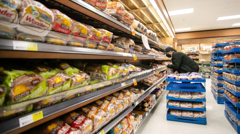 A worker restocks shelves in the bakery and bread aisle at an Atlantic Superstore grocery in Halifax, Friday, Jan. 28, 2022. THE CANADIAN PRESS/Kelly Clark