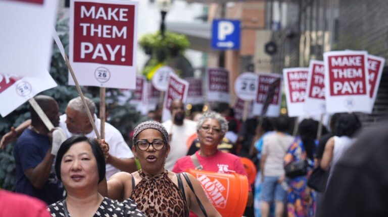 Union members from Local 26, representing workers in the hospitality industries of Massachusetts, picket outside the Hyatt Regency Boston, Wednesday, July 17, 2024, in Boston. (AP Photo/Charles Krupa)