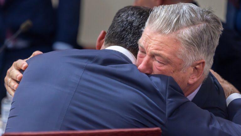 Alec Baldwin, right, hugs his defence attorney after a judge threw out the involuntary manslaughter case in Santa Fe, N.M., on July 12, 2024. (Luis Sánchez Saturno / Santa Fe New Mexican via AP)
