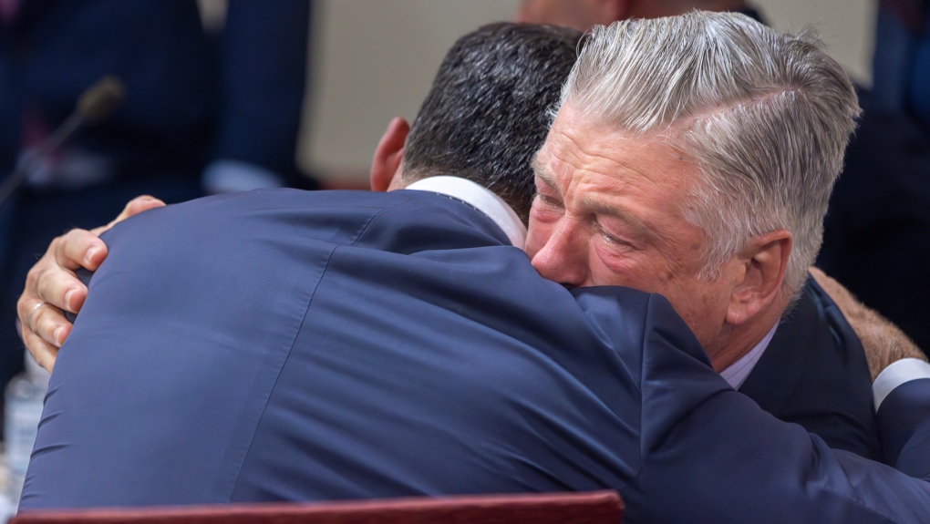 Alec Baldwin, right, hugs his defence attorney after a judge threw out the involuntary manslaughter case in Santa Fe, N.M., on July 12, 2024. (Luis Sánchez Saturno / Santa Fe New Mexican via AP)