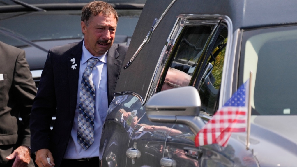 Guy Gaudreau looks into a hearse containing the remains of his son John Gaudreau after his and his brother's Matthew Gaudreau funeral at St. Mary Magdalen Catholic Church on Sept. 9, 2024. (Matt Rourke/AP Photo)