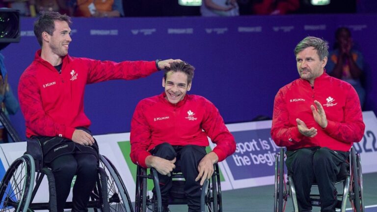 Canada's Colin Higgins, Vincent Dallaire and Robert Hedges, left to right, wait for their silver medals in 3 x 3 men's wheelchair basketball at the Commonwealth Games in Birmingham, England on August 2, 2022. THE CANADIAN PRESS/Andrew Vaughan