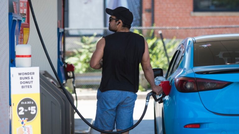 A commuter pumps gas into their vehicle at a Esso gas station in Toronto on Tuesday, June 15, 2021. THE CANADIAN PRESS/ Tijana Martin