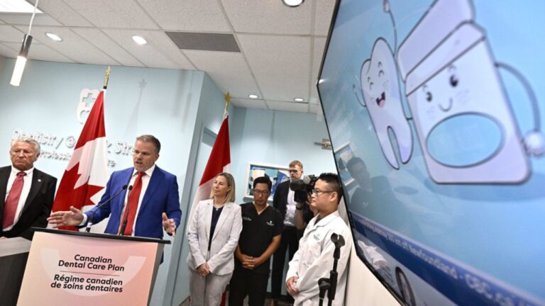 Health Minister Mark Holland says his government will still work on policies it promised to pursue under its now-defunct deal with the NDP. An illustration of a tooth is seen on a screen in a dental office as Holland makes an announcement on the Canadian Dental Care Plan in Ottawa, on Wednesday, Aug. 7, 2024. THE CANADIAN PRESS/Justin Tang