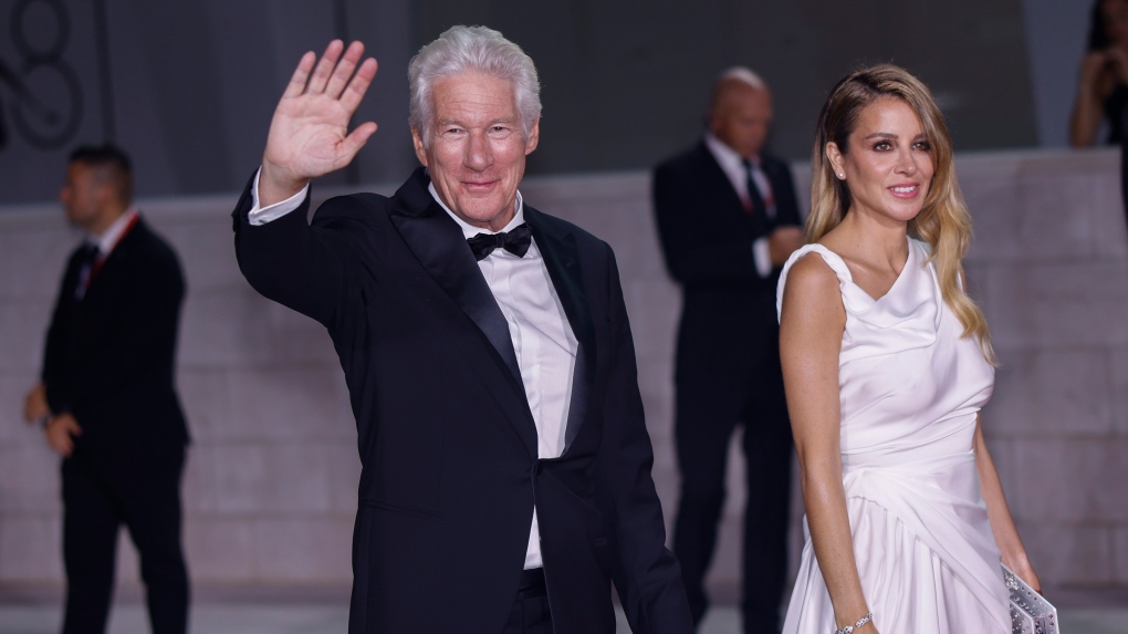 Richard Gere and Alejandra Silva arrive for the premiere of the film 'Wolfs' during the Venice Film Festival on Sept. 1, 2024. (Vianney Le Caer / Invision / AP)