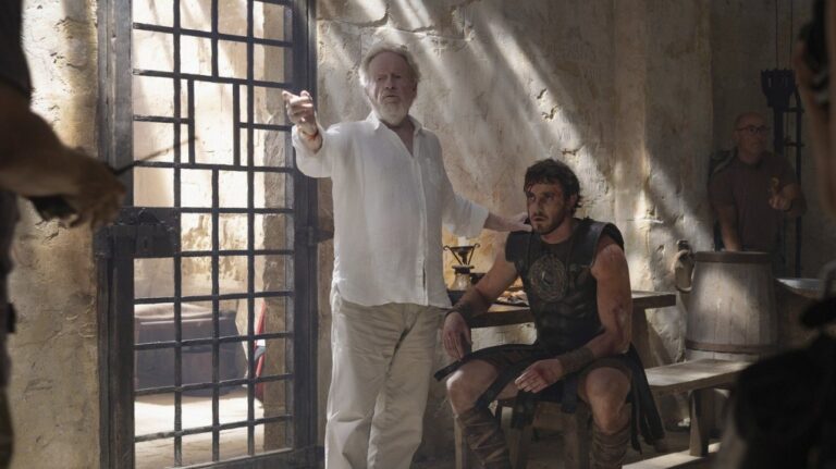 This image released by Paramount Pictures shows director Ridley Scott, center, Paul Mescal on the set of "Gladiator II." (Aidan Monaghan/Paramount Pictures via AP)