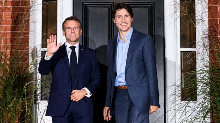 Prime Minister Justin Trudeau, right, greets French President Emmanuel Macron outside Rideau Cottage in Ottawa on Sept. 25, 2024. (Justin Tang / The Canadian Press)