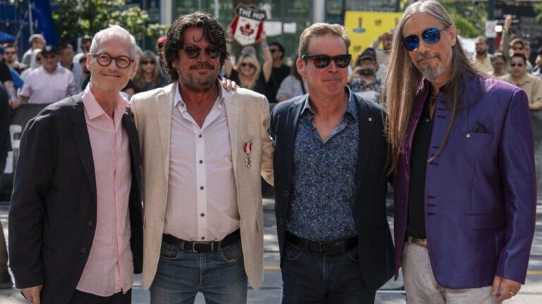 Johnny Fay, Paul Langlois, Gord Sinclair and Rob Baker of The Tragically Hip stand for a photo at the Toronto International Film Festival on Sept. 5, 2024. (Paige Taylor White/The Canadian Press)