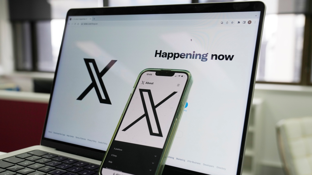 The opening page of X is displayed on a computer and phone, Oct. 16, 2023, in Sydney. (Rick Rycroft / AP Photo, File)