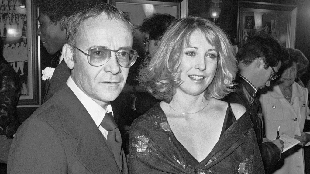 In this Nov. 15, 1977, file photo, Buck Henry and Teri Garr appear at the opening of the movie 'Close Encounters of the Third Kind' in New York. (Ira Schwarz / AP Photo, File)