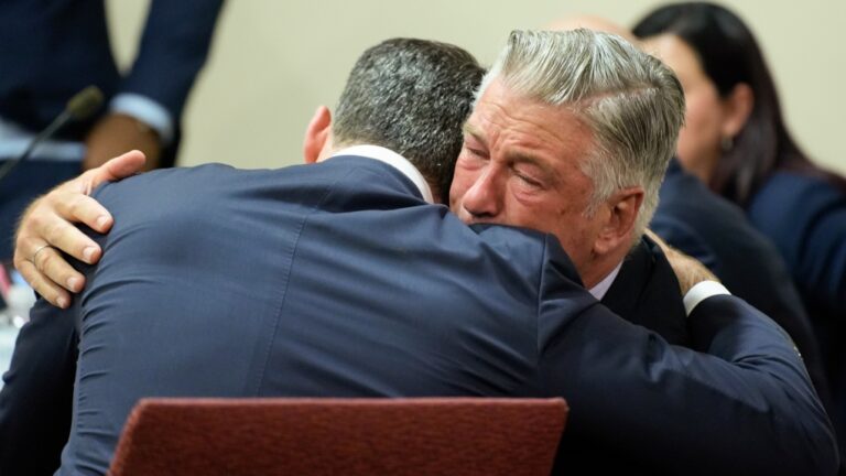 Actor Alec Baldwin, right, hugs his attorney Alex Spiro after the judge threw out the involuntary manslaughter case for the 2021 fatal shooting of cinematographer Halyna Hutchins during filming of the Western movie 'Rust,' Friday, July 12, 2024, in Santa Fe, N.M. (Ramsay de Give/Pool Photo via AP)