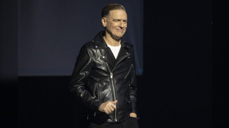 Bryan Adams walks on stage to introduce David Foster at the Canadian Songwriters Hall of Fame Gala in Toronto, on Saturday Sept. 24, 2022. Global hitmaker Bryan Adams is adding his voice to opposition to new federal regulations on streaming. THE CANADIAN PRESS/Chris Young