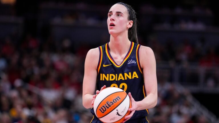 Indiana Fever guard Caitlin Clark (22) shoots a free throw against the Dallas Wings in the second half of a WNBA basketball game in Indianapolis, Sunday, Sept. 15, 2024. (Michael Conroy / AP Photo)