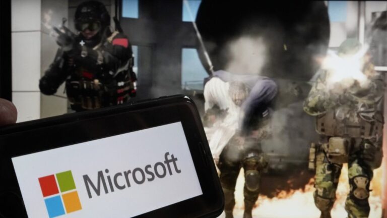 The logo for Microsoft, and a scene from Activision 'Call of Duty - Modern Warfare,' are shown in this photo, in New York, June 21, 2023. (AP Photo/Richard Drew, File)