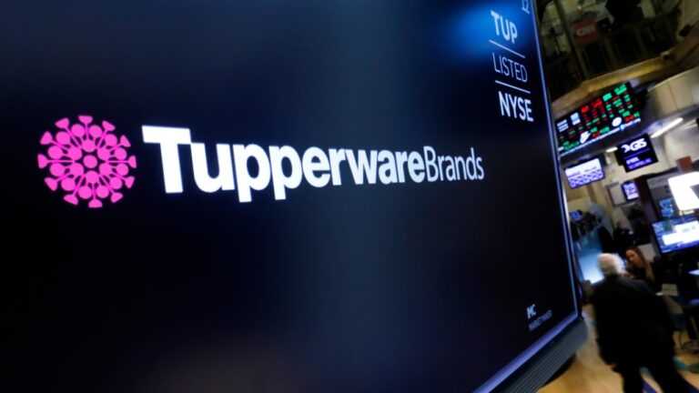 FILE - The logo for Tupperware Brands appears above a trading post on the floor of the New York Stock Exchange on Oct. 30, 2019. (Richard Drew / AP Photo)