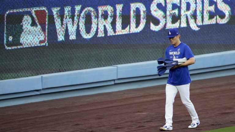Los Angeles Dodgers pitcher Yoshinobu Yamamoto arrives during batting practice during media day for the baseball World Series against the New York Yankees, Thursday, Oct. 24, 2024, in Los Angeles. (AP Photo/Ashley Landis)