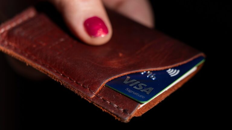 A Visa card is displayed in a wallet on Wednesday, May 15, 2024, in Portland, Ore. (Jenny Kane / The Canadian Press/ AP)