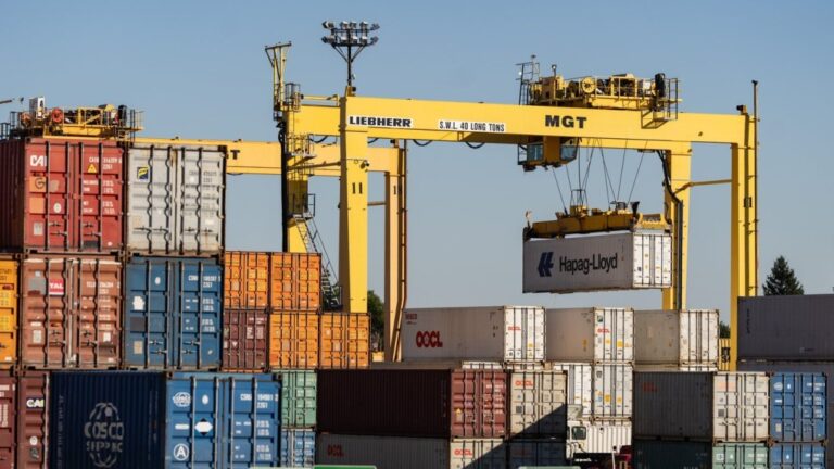 Shipping containers are moved in the Port of Montreal, in Montreal, Monday, Sept. 30, 2024. THE CANADIAN PRESS/Christinne Muschi