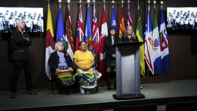 NDP member of Parliament Leah Gazan, second from right, is joined by Special Interlocutor Kimberly Murray, right, and Indian Residential School survivors during a press conference on Parliament Hill in Ottawa on Thursday, Oct. 30, 2024. THE CANADIAN PRESS/Sean Kilpatrick