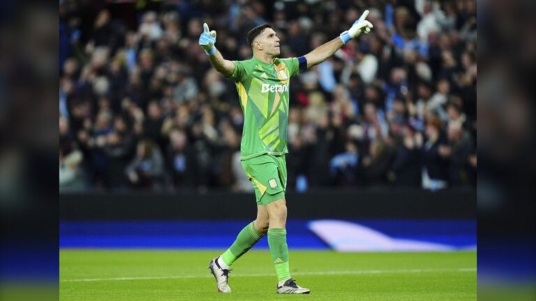 Aston Villa's goalkeeper Emiliano Martinez celebrates during the Champions League opening phase soccer match between Aston Villa and Bayern Munich, at Villa Park in Birmingham, England, Wednesday, Oct. 2, 2024. (Mike Egerton/PA via AP)