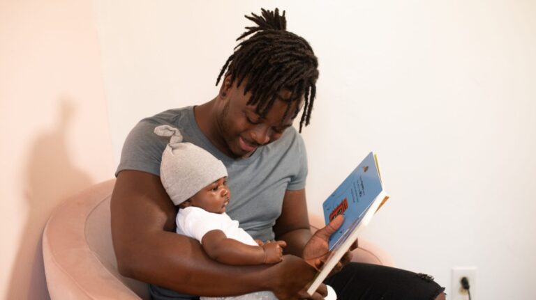 A father and baby are seen in this undated file photo. (Photo by nappy from Pexels)
