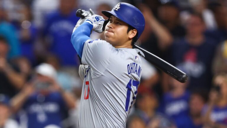 Shohei Ohtani hits a two-run home run, his 50th of the 2024 season, becoming the first player with a 50/50 season in MLB history. (Megan Briggs/Getty Images via CNN Newsource)