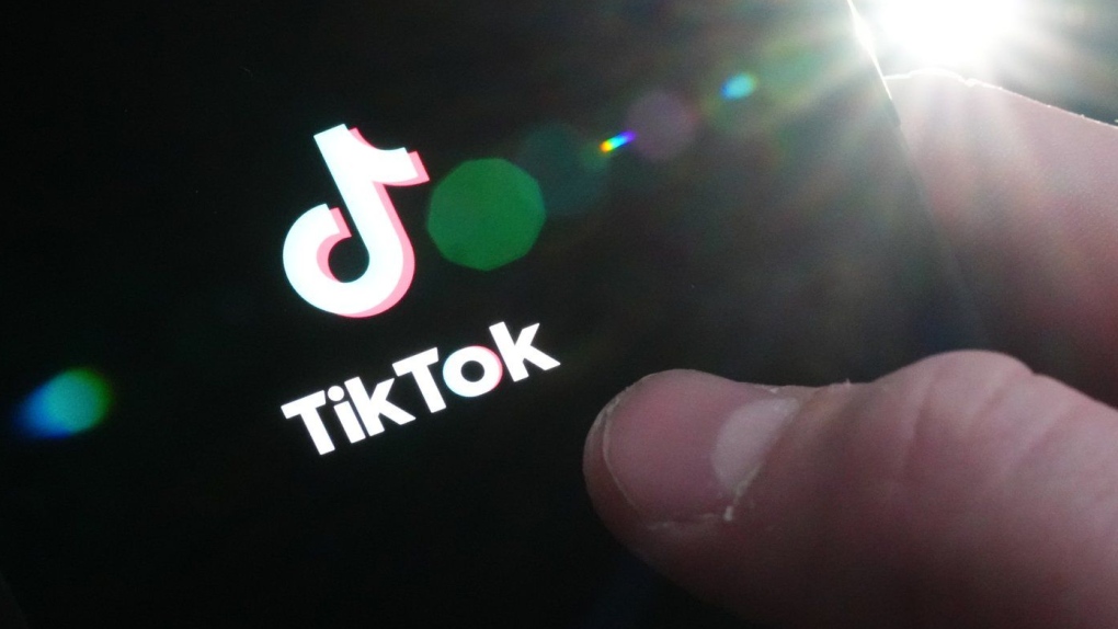 The TikTok startup page is displayed on an iPhone in Ottawa, Monday, Feb. 27, 2023. (THE CANADIAN PRESS/Sean Kilpatrick)