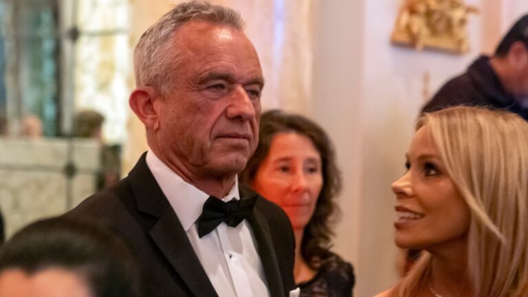 Robert F. Kennedy Jr., and his wife Cheryl Hines arrive before U.S. President-elect Donald Trump speaks during an America First Policy Institute gala at his Mar-a-Lago estate, Thursday, Nov. 14, 2024, in Palm Beach, Fla. (AP Photo/Alex Brandon)