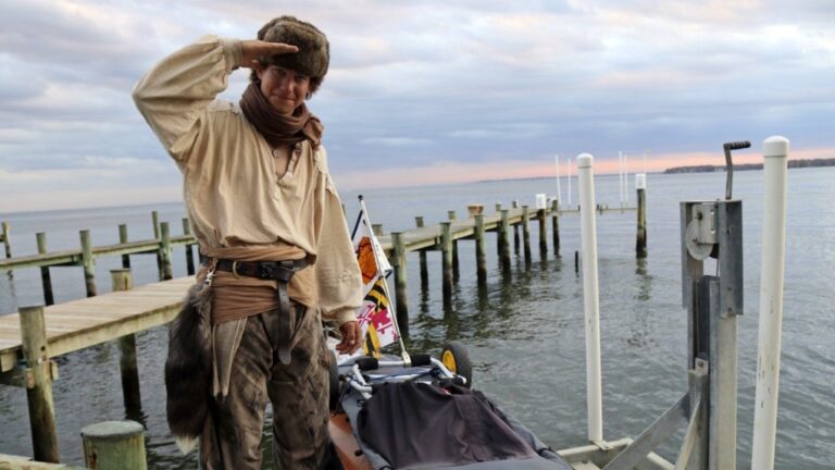 Peter Frank stands by his canoe in Annapolis, Md., on Thursday, Nov. 7, 2024, a day before he plans to resume his trip along the Great Loop in what is nearly a 10,000-kilometre voyage and that he estimates will take him a total of about 17 months. (AP Photo/Brian Witte)