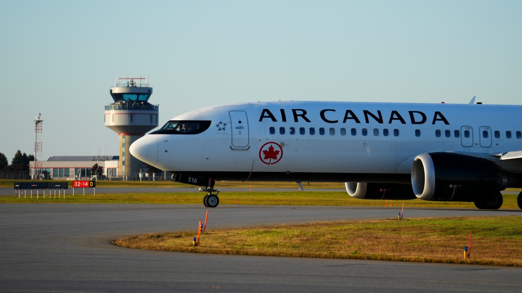 An Air Canada plane taxies down the runway at the Ottawa International Airport on Oct. 3, 2024. (Sean Kilpatrick / The Canadian Press)