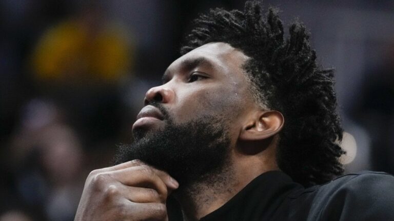 Philadelphia 76ers' Joel Embiid watches from the bench during the second half of an NBA basketball game against the Indiana Pacers, Sunday, Oct. 27, 2024, in Indianapolis. (Darron Cummings/AP Photo)