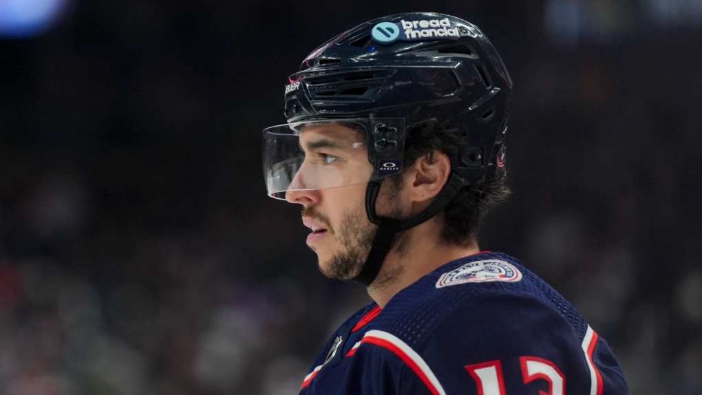 Columbus Blue Jackets' Johnny Gaudreau (13) awaits the face-off during an NHL hockey game against the Nashville Predators, March 9, 2024, in Columbus, Ohio. (AP Photo/Aaron Doster)