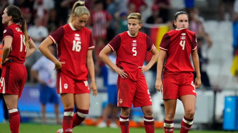 Canada players react after losing a women's quarterfinal soccer match between against Germany at the 2024 Summer Olympics, Saturday, Aug. 3, 2024, at Marseille Stadium in Marseille, France. (AP Photo/Julio Cortez)