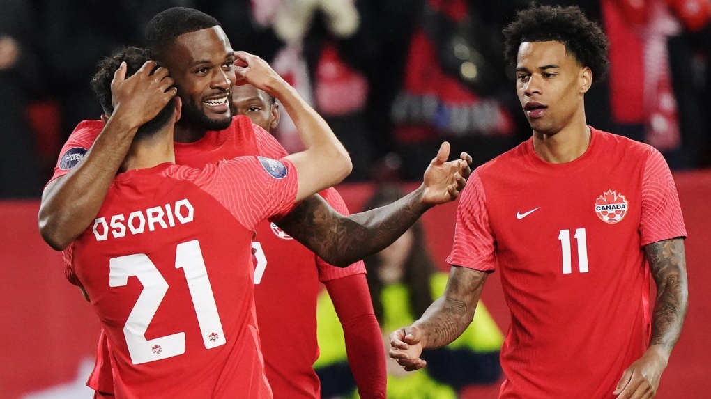 Canada forward Cyle Larin (second left) celebrates his goal against Honduras with teammates Jonathan Osorio (21) and Tajon Buchanan (11) during first half CONCACAF Nations League soccer action in Toronto on Tuesday, March 28, 2023. THE CANADIAN PRESS/Nathan Denette