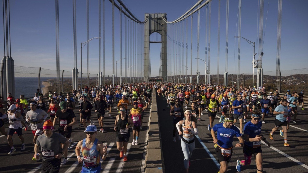Runners cross the Verrazzano-Narrows Bridge at the start of the New York City Marathon, Sunday, Nov. 3, 2024, in New York. (AP Photo/Yuki Iwamura)